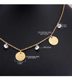 Detail of 316L stainless steel gold necklace with hammered discs and AAA zircon charms