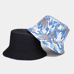 Detail of a black and blue camo reversible bucket hat showing durable canvas texture