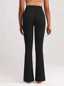 High-waisted black yoga flare pants with slimming tummy control and butt lifting effect
