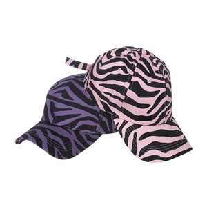 Detailed view of pink and purple zebra pattern baseball caps with high-quality stitching