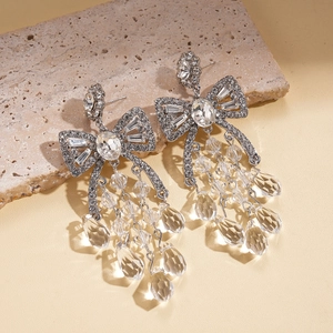 Elegant silver bow earrings with sparkling rhinestones and crystal drop tassels