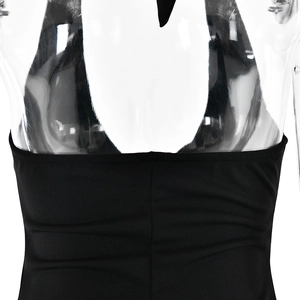 Detail of black halter neck dress with open back design and sleek elastic fabric texture