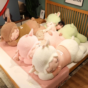 Cozy bedroom setting showing the large plush sheep pillow with knitted LOVE sweater