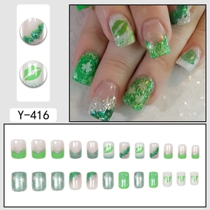Short glossy clover press-on nails in green and silver glitter with french tips