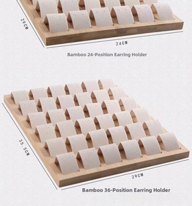 Bamboo jewelry organizer showing 24 and 36 slot stud earring display trays in light wood