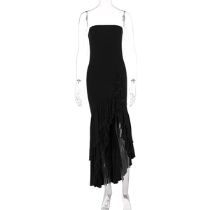 Detail of black tube dress with ruffle hem and asymmetric high-low skirt design