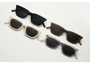 Collection of vintage cat-eye sunglasses in black, beige, tortoiseshell and clear grey