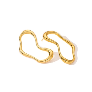 Detail of minimalist gold-plated irregular wavy earrings with high-polish mirror finish