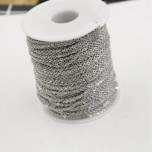 Roll of silver 1.5mm square cross chain on white plastic spool for jewelry making