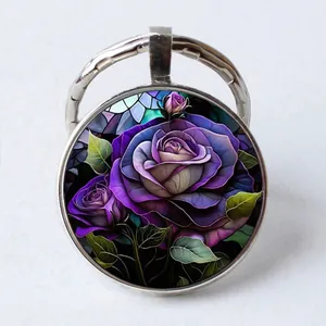 Silver round glass cabochon keychain featuring a purple rose art illustration