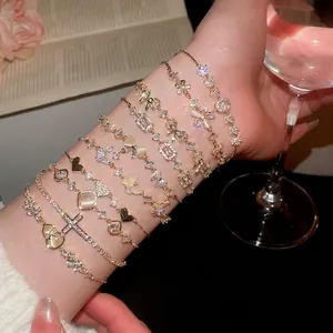 Elegant gold-plated flower and butterfly bracelet set with zircon stones on wrist