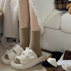 Women's cozy cream fleece slippers paired with warm brown winter mid-calf socks