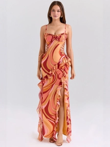 Slim fit summer maxi dress with orange fluid print, side cut-outs and ruffled hemline