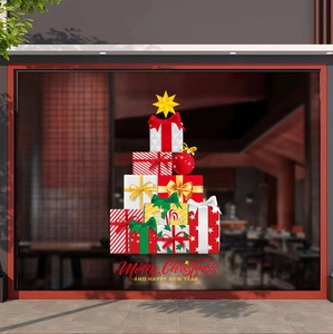Detail of Christmas gift box tree window sticker with Merry Christmas text on glass