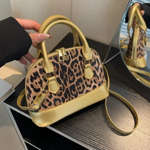Minimalist leopard print crossbody bag with gold metallic handles and accents for women