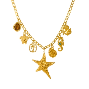 Gold ocean theme necklace with starfish and seahorse pendants on a white background