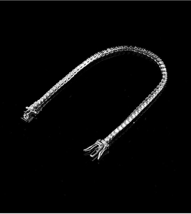 Macro detail of S925 sterling silver 2mm tennis bracelet with sparkling moissanite stones