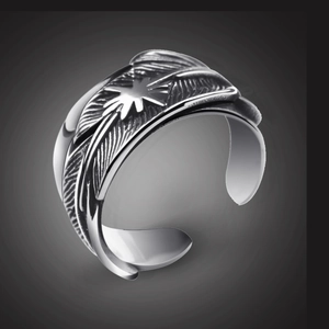 Close-up of vintage silver octopus tentacle ring with feather texture and star motif