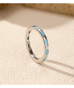 Macro view of S925 silver ring featuring blue enamel details and S925 hallmark