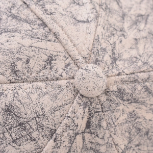 Macro shot of baseball cap crown with tie-dye marble texture and stitching details