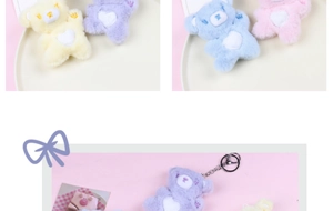 Detailed view of colorful plush bear keychains with white heart belly patterns and metal rings