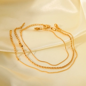 Three-piece gold titanium steel bracelet set with snake, rope, and bead chain designs