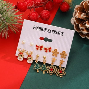 Detailed view of 6-pair Christmas earring set with Santa, reindeer and tree charms