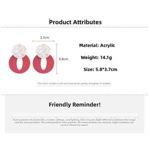 Detail view of red acrylic hoop earrings with white marble studs and size measurements