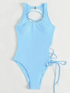 Flat lay of light blue backless one-piece swimsuit with lace-up side and halter neck