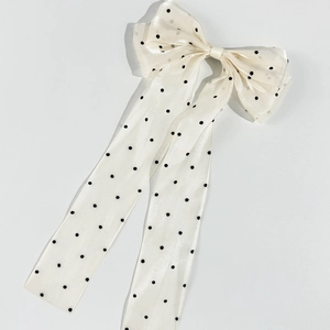 Elegant white polka dot mesh bow hair clip with long ribbons for a vintage aesthetic