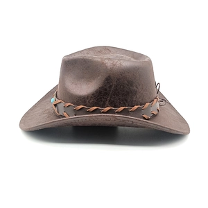Detail of vintage dark brown cowboy hat with textured finish and woven leather belt