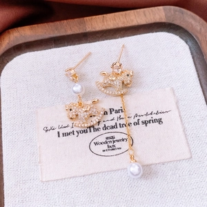 18k gold plated asymmetrical rocking horse earrings with pearls and zircon inlay