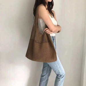 Brown woven knit tote bag with large capacity mesh design for shoulder carrying