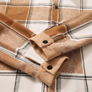 Brown plaid flannel shirt featuring corduroy cuff details and matte black buttons