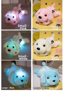 Detailed comparison of glowing plush dogs in pink, white and blue across two sizes