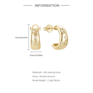Detail showing gold 925 sterling silver star-shaped C-hoop earrings with AAAAA zirconias