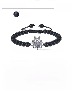 Detailed technical diagram of a dog paw projection bracelet with turquoise beads
