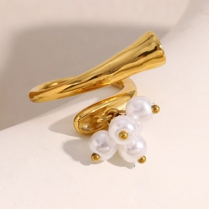 Detailed macro view of an 18K gold plated irregular open ring with white pearl charms