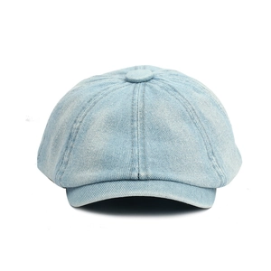 Classic light blue washed denim newsboy cap with six-panel design and curved brim