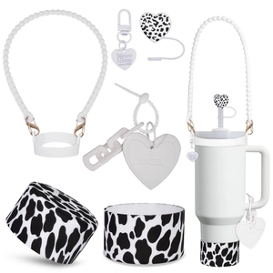Detail showing silicone boot, heart charm, handle strap and straw cover set for large tumblers