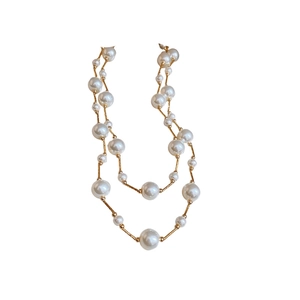 Elegant double-layered faux pearl necklace with gold metal chains in minimalist French style