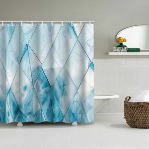 Blue geometric ice crystal pattern shower curtain detail with white hanging rings