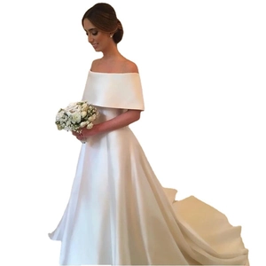 Elegant white off-shoulder satin wedding gown with a long trailing skirt for brides