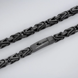 Close-up of black Byzantine stainless steel necklace showing intricate woven chain links