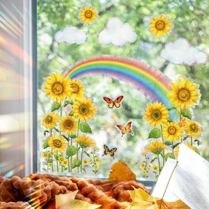Macro detail of holographic sunflower and butterfly window stickers with prism rainbow effect