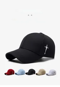 Detail of embroidered cross on side of black baseball cap with color variety display
