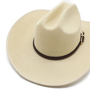 Detailed macro view of the dense beige woven texture and leather belt on the cowboy hat
