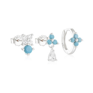 Macro detail of S925 sterling silver earring set with turquoise and white zircon stones