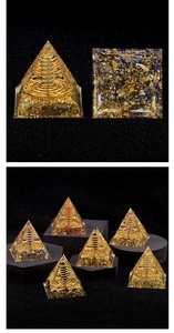 Macro shot of 6cm Orgonite Pyramids with resin crystals, metal coils and gold foil layers