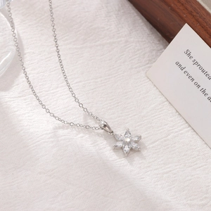 Elegant silver flower necklace with white zircon petals on a minimalist chain for women